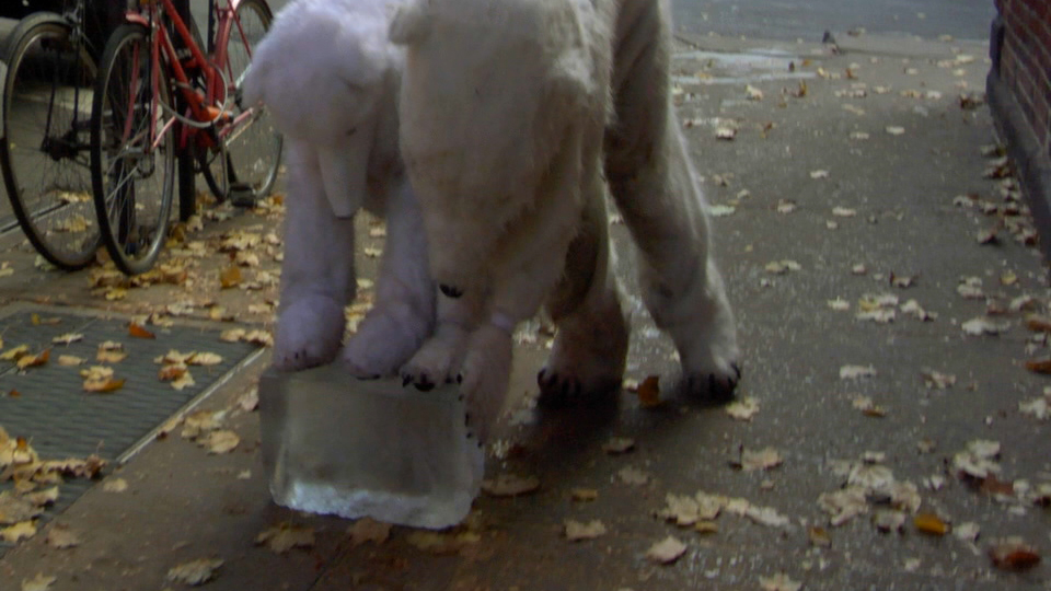 Two bears pushing a giant ice cube in NYC